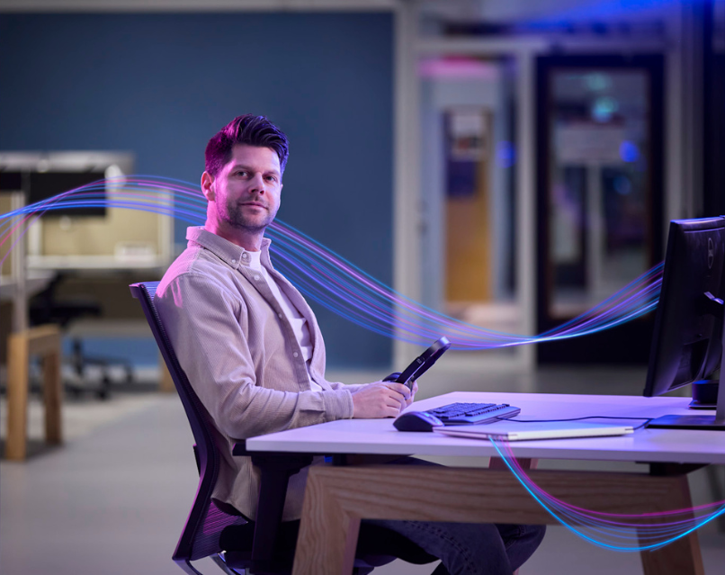 Man working on his computer gaining insights thru AI