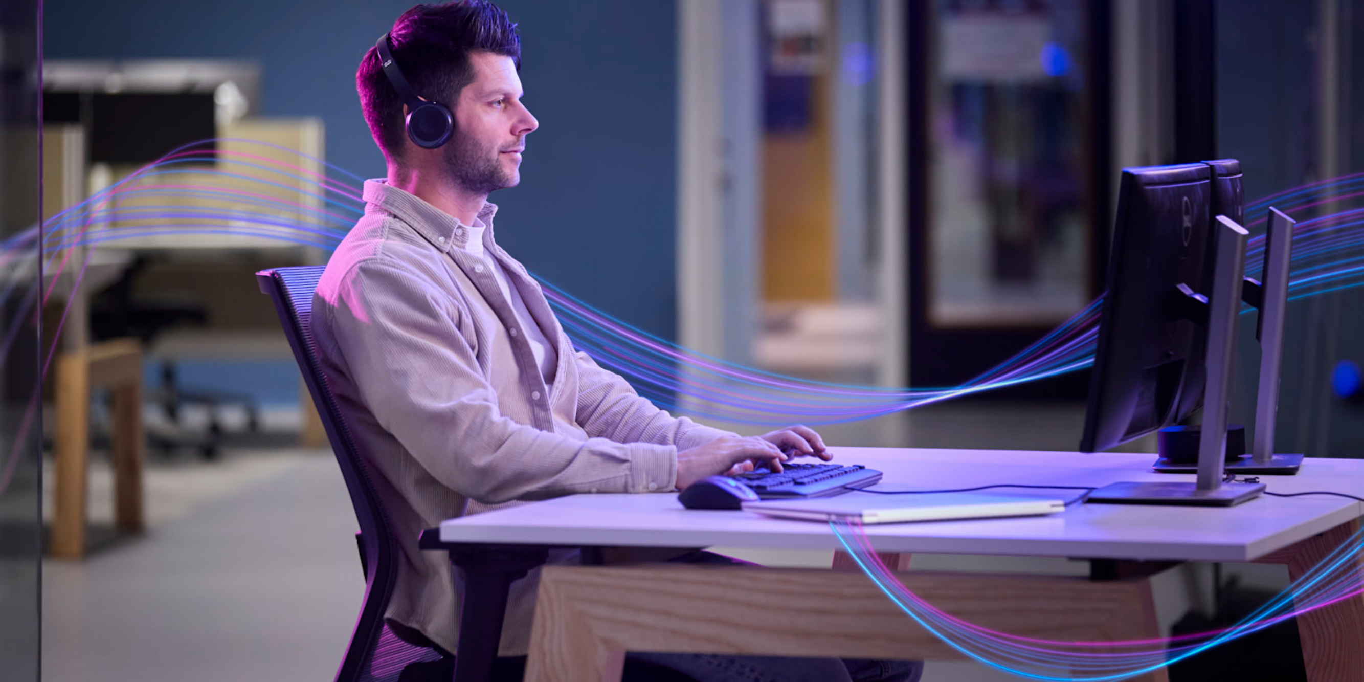 Man working on his computer gaining insights thru AI