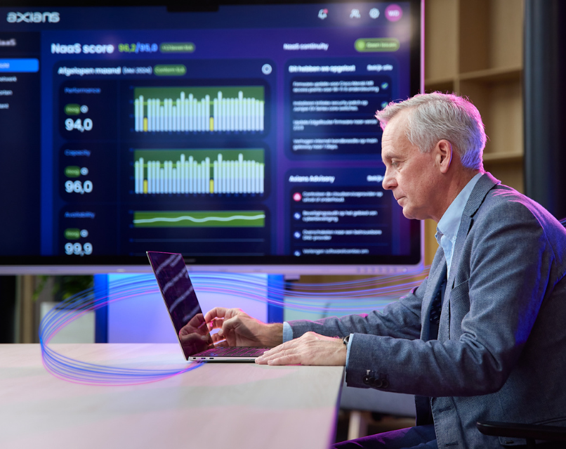 Man working on his computer gaining insights thru AI